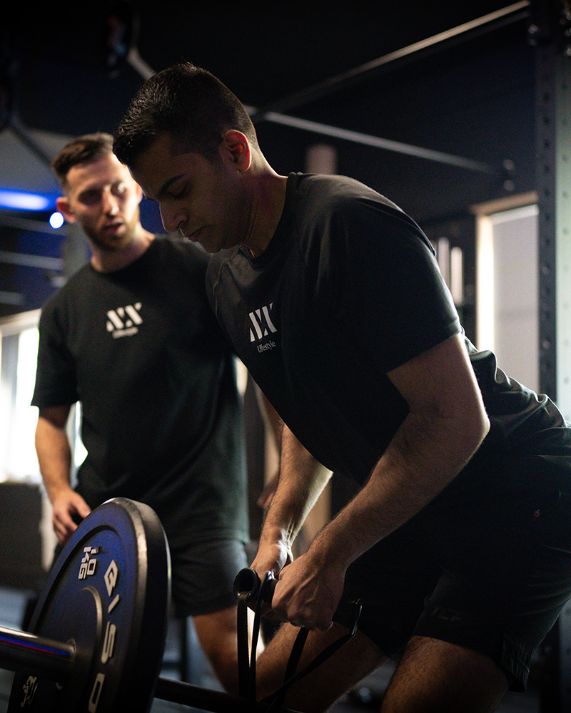 Personal trainer coaching a client